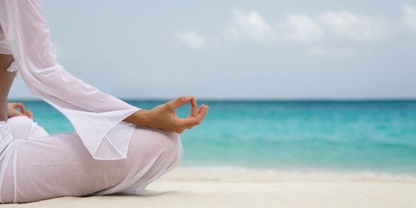 woman-meditating-on-the-beach