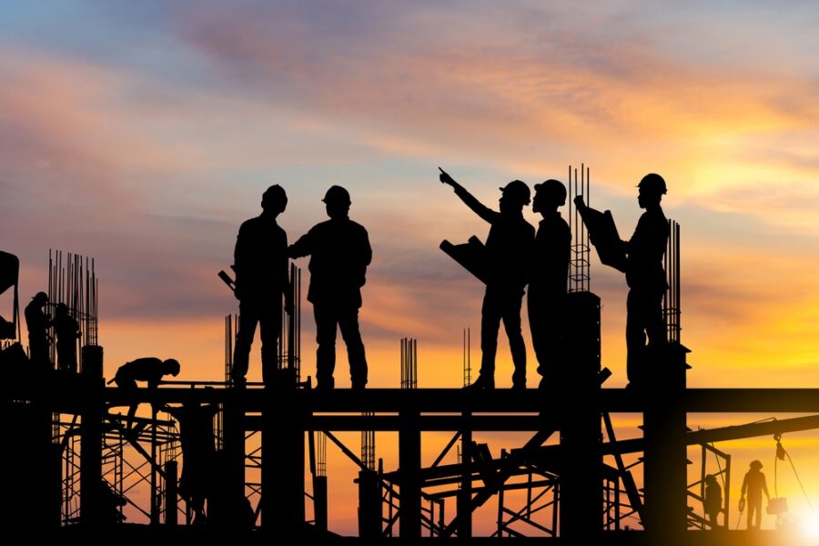 silhouetteofengineerandworkeronbuildingsiteconstructionsite